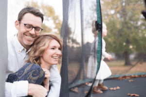 hugging parents outside of trampoline