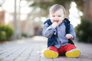 baby in plaid sitting up