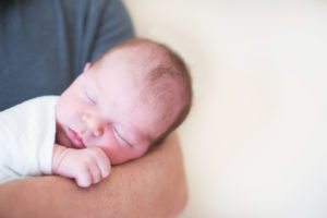 new baby in father's arms
