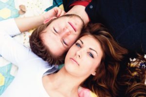 laying down engagement shot