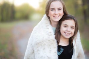 sisters wrapped in fur