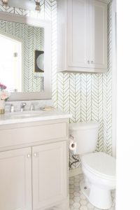 10 Beautiful Ideas for How To Use Wallpaper in Modern Home Design marble hexagon tile floor gray bathroom vanity gold hardware serena and lily wallpaper bathroom styling gold bathroom sconce-1
