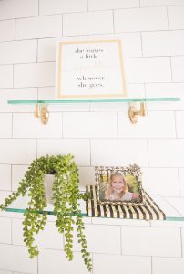 Modern Glam Blush Girls Bathroom Design gold hexagon mirror blush cabinets gold hardware white hexagon floor glass shelves pink bathroom cabinets gold orb sconce-1-3