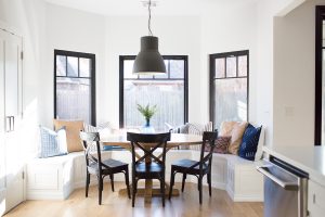 Tulsa Remodel Reveal Modern White Farmhouse black windows and doors black windows and doors built in window seat banquette dining room black pendant lighting-1-2