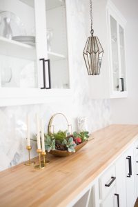 Tulsa Remodel Reveal Modern White Farmhouse black windows and doors marble herringbone backsplash bar butcher block countertop white cabinets black hardware bar faceted pendant lighting-1-2