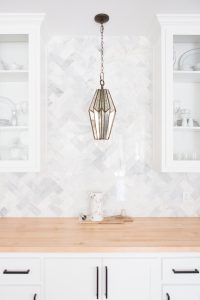 Tulsa Remodel Reveal Modern White Farmhouse black windows and doors marble hexagon tile backsplash faceted pendant light butcher block countertop black hardware-1