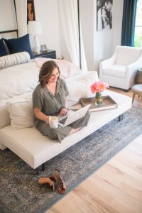 West Elm Modern Baby and Kids Furniture and Home Decor canopy bed master bedroom wood tray hearth and hand vase with peonies linen bedding navy velvet pillows black and white bolster pillow olive Target tie front jumpsuit black night stands juju hat above bed linen bedding