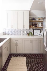 Affordable Ceramic Patterned Tile Backsplash affordable cement tile lookalike black and white patterned tile backsplash open wood shelves kitchen open wood shelves styling ideas how to style open wood shelving blue west elm vase wooden picture frames greige cabinets