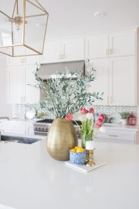 Affordable Ceramic Patterned Tile Backsplash affordable modern gold bar stools white kitchen with gold hardware design ideas patterned tile backsplash kitchen gold kitchen lantern lighting faux stems kitchen styling blue and white kitchen bowls
