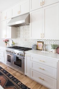 Affordable Ceramic Patterned Tile Backsplash affordable modern gold bar stools white kitchen with gold hardware design ideas patterned tile backsplash kitchen gold kitchen lantern lighting