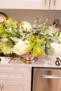 DIY Silver Urn Pumpkin Centerpiece for Fall floral sponges inside of a silver urn for a DIY fall centerpiece