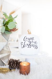 Simple Ways to Decorate for the Holidays from West Elm copper votive candles and pinecones