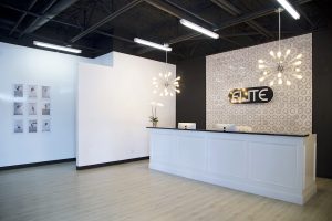 elite dance studio with white walls and fun pendants