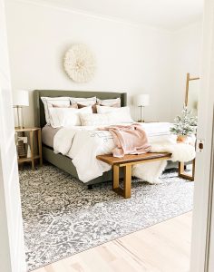 How to Get Your Guest Bedroom Holiday Ready Serena and Lliy Bedding Gray upholstered bed with wood bench and juju hat