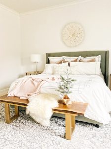 How to Get Your Guest Bedroom Holiday Ready Serena and Lliy Bedding Gray upholstered bed with wood bench and juju hat