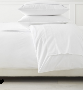 How to Get Your Guest Bedroom Holiday Ready Serena and Lliy Bedding Gray upholstered bed with wood bench and juju hat
