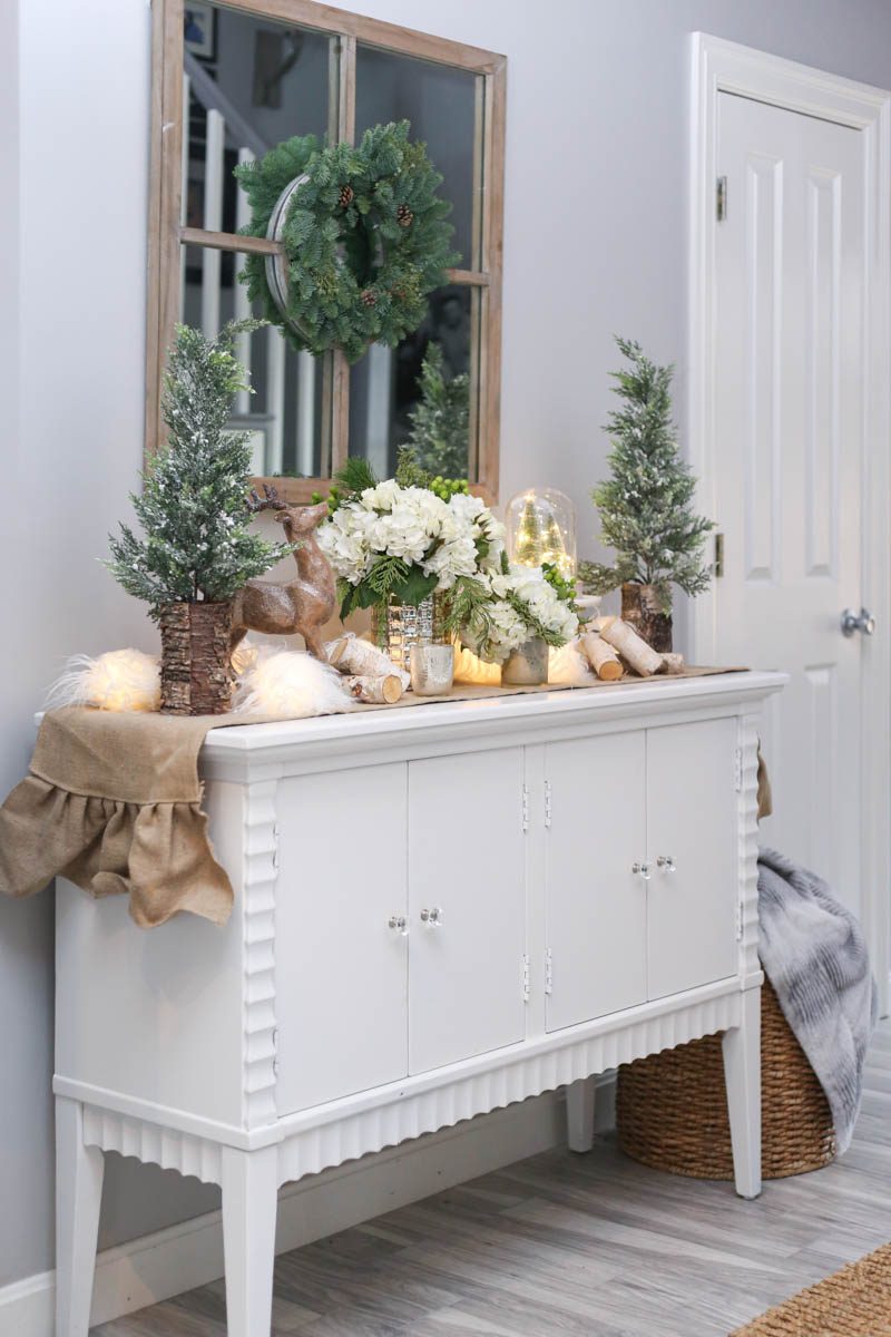 Black Friday and Cyber Monday Sales from Wayfair White Console with pine trees and christmas lights