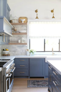 CC and Mike Frisco I Project Reveal-63 gray kitchen island and cabinets with wood bar stools quartz countertops and gold lanterns large kitchen window with gold sconces