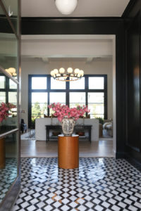 CC and MIke Kitchen Remodel Reveal large natural wood island with quartz countertops and gold bar stools living room with navy rug slipcover crypton fabric navy Hathaway navy velvet pillows leopard ottomans marble coffee tables
