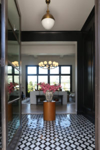 CC and MIke Kitchen Remodel Reveal large natural wood island with quartz countertops and gold bar stools living room with navy rug slipcover crypton fabric navy Hathaway navy velvet pillows leopard ottomans marble coffee tables