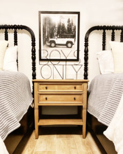 How-to-Decorate-Boys-Room-on-a-Budget wood nightstand wire boys only sign vintage Land Rover framed photo Jenny Lind black bed boys room design